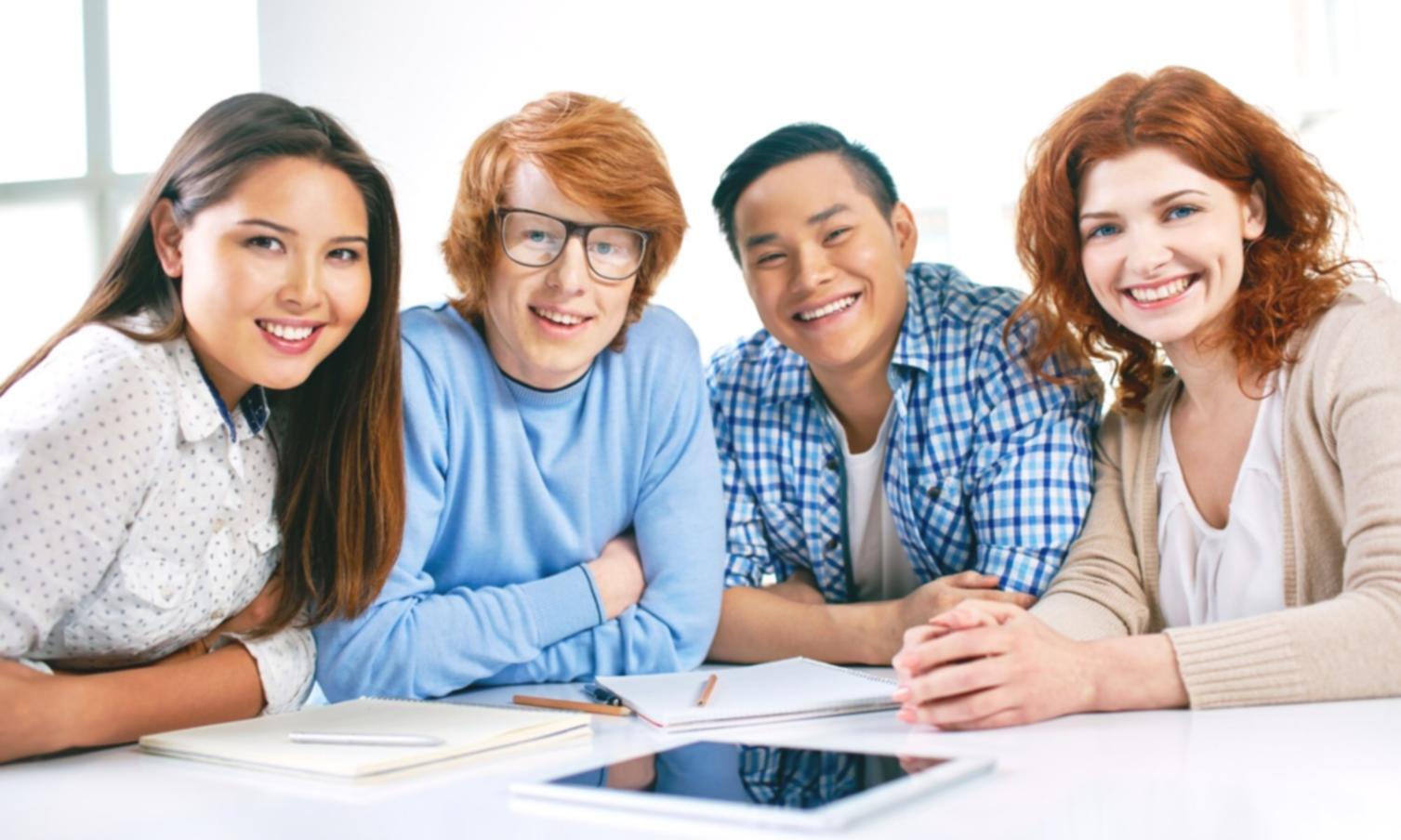 Group learning session with financial planning materials on table