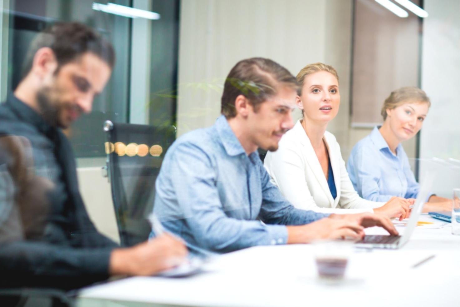 Workshop participants reviewing budgeting materials and financial planning documents